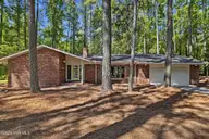 228 Heather Lane, Southern Pines, NC 28387 — 3-bedroom home in Highland Trails, Southern Pines, NC, photo 1 of 43: Front