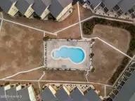 918 N New River Drive 322, Surf City, NC 28445 — 1-bedroom condo in Surf Condominiums, Surf City, NC, photo 14 of 38: DJI_20250220174431_0731_D