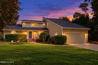 152 Arborvitae Drive, Pine Knoll Shores, NC 28512 — 3-bedroom waterfront home in Pine Knoll Association, Pine Knoll Shores, NC, photo 6 of 61: Virtually Staged front of house