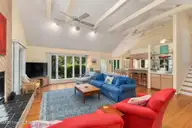 579 Coral Ridge Road, Pine Knoll Shores, NC 28512 — 4-bedroom waterfront home in Beacon's Reach, Pine Knoll Shores, NC, photo 10 of 62: Living Room Area w/ Large Windows