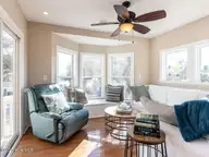 129 Sunset Drive, Cedar Point, NC 28584 — 3-bedroom waterfront home in Plantation Shores, Cedar Point, NC, photo 8 of 46: 007-1280x960-sunroom