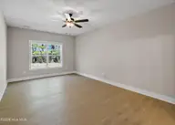 161 Twining Rose Lane, Holly Ridge, NC 28445 — 3-bedroom home in Summerhouse On Everett Bay, Holly Ridge, NC, photo 13 of 62: main floor primary suite