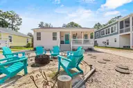 316 NE 52nd Street, Oak Island, NC 28465 — 3-bedroom home in Tranquil Harbor, Oak Island, NC, photo 4 of 49: 6_fire pit