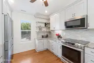 106 Wyndward Court, Emerald Isle, NC 28594 — 4-bedroom home in Wyndtree, Emerald Isle, NC, photo 10 of 63: Kitchen with granite countertops