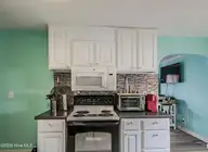 1937 Jackson Street, Wilmington, NC 28401 — 3-bedroom home in Sunset Park, Wilmington, NC, photo 6 of 22: kitchen cooking area