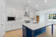 116 Antebellum Drive, Havelock, NC 28532 — 4-bedroom home in Plantation Harbor, Havelock, NC, photo 8 of 42: Large Open Kitchen w/ Island