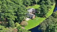 105 Dogwood Trail, Elizabeth City, NC 27909 — 4-bedroom waterfront home in Pine Lake, Elizabeth City, NC, photo 4 of 36: Canal