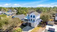503 W Yacht Drive, Oak Island, NC 28465 — 4-bedroom home in Tranquil Harbor, Oak Island, NC, photo 3 of 53: Drone of home