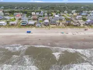 210 W Beach Drive, Oak Island, NC 28465 — 4-bedroom waterfront home, Oak Island, NC, photo 6 of 42: 6-web-or-mls-DJI_20250614140102_0271_D