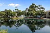 300 Mcginnis Drive, Pine Knoll Shores, NC 28512 — 3-bedroom waterfront condo in Mcginnis Point, Pine Knoll Shores, NC, photo 1 of 57: Rear Pond and Sound View