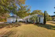 1600 Chip Shot Drive, Morehead City, NC 28557 — 3-bedroom home in Country Club East, Morehead City, NC, photo 1 of 57: Front Exterior - Photo