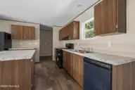 580 S Windward Drive SW, Supply, NC 28462 — 3-bedroom manufactured home in Ocean Trail II, Supply, NC, photo 12 of 32: Kitchen