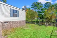 2807 Cross Bones Road SW, Supply, NC 28462 — 3-bedroom waterfront manufactured home in Buccaneer Hills, Supply, NC, photo 22 of 31: Pond Front