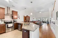 8962 Smithfield Drive NW Unit 2, Calabash, NC 28467 — 3-bedroom townhome in Brunswick Plantation, Calabash, NC, photo 8 of 59: Kitchen to LR