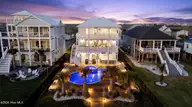 9059 W 9th Street, Surf City, NC 28445 — 4-bedroom waterfront home in Old Settlers Beach, Surf City, NC, photo 1 of 76: 98_dji_20260416200420_0443_d