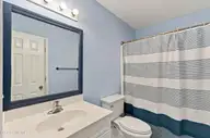 507 Sunset Oaks Lane, Sunset Beach, NC 28468 — 3-bedroom townhome in Sunset Oaks Garden Homes, Sunset Beach, NC, photo 12 of 22: 47_hallway bathroom