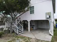 3518 E Beach Drive, Oak Island, NC 28465 — 3-bedroom waterfront home in E. Long Beach, Oak Island, NC, photo 7 of 39: DJI_0304