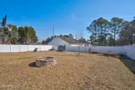 1011 Weathervane Hill Drive, Rocky Mount, NC 27803 — 3-bedroom home in Weathervane Hill, Rocky Mount, NC, photo 24 of 26: Fire pit & raised Beds