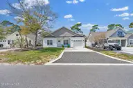 125 NE 15th Street, Oak Island, NC 28465 — 3-bedroom home in Tranquil Harbour Island, Oak Island, NC, photo 2 of 47: 125 NE 15th Street -37