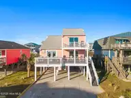 5518 E Beach Drive, Oak Island, NC 28465 — 5-bedroom waterfront home in E. Long Beach, Oak Island, NC, photo 1 of 55: 5518 E Beach Drive