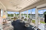 906 Jewell Court, New Bern, NC 28560 — 4-bedroom waterfront home in Fairfield Harbour, New Bern, NC, photo 5 of 52: Sunroom