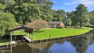 105 Dogwood Trail, Elizabeth City, NC 27909 — 4-bedroom waterfront home in Pine Lake, Elizabeth City, NC, photo 5 of 36: Bulkhead