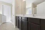 404 Hidden Oaks Drive, Jacksonville, NC 28546 — 3-bedroom home in Hunters Creek, Jacksonville, NC, photo 17 of 28: Modern bathroom with double vanity