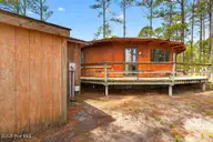 1415 Mona Passage Court, New Bern, NC 28560 — 3-bedroom waterfront home in Fairfield Harbour, New Bern, NC, photo 16 of 38: Side View