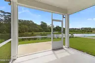 212 Windswept Lane, Beaufort, NC 28516 — 4-bedroom home in Beaufort Club, Beaufort, NC, photo 17 of 49: Screened in Porch with Views