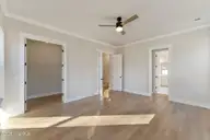 115 S Middleton Drive NW, Calabash, NC 28467 — 4-bedroom waterfront home in Brunswick Plantation, Calabash, NC, photo 16 of 38: Primary Suite