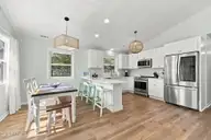 118 Periwinkle Drive, Emerald Isle, NC 28594 — 3-bedroom home in Shell Cove, Emerald Isle, NC, photo 10 of 39: 10 Kitchen and dining area