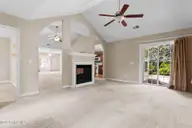 76 Calabash Drive, Calabash, NC 28467 — 3-bedroom home in Carolina Shores, Calabash, NC, photo 8 of 32: Carolina Room Fireplace kitchen
