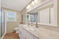 326 Wheat Street, Kinston, NC 28504 — 3-bedroom home in Jackson Heights, Kinston, NC, photo 19 of 26: Hall Bath with Dual Sinks