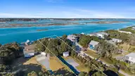 460 N Anderson Boulevard, Topsail Beach, NC 28445 — 3-bedroom waterfront home, Topsail Beach, NC, photo 2 of 58: 59_dji_20251209144954_0035_d-ll