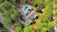 10 Ashkirk Drive, Pinehurst, NC 28374 — 5-bedroom home in Pinewild CC, Pinehurst, NC, photo 4 of 66: 5_DJI_20260911132616_0031_D