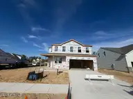 4297 Farmfield Drive, Navassa, NC 28451 — 4-bedroom home in Lakes at Riverbend, Navassa, NC, photo 1 of 13: Emerson 210 B