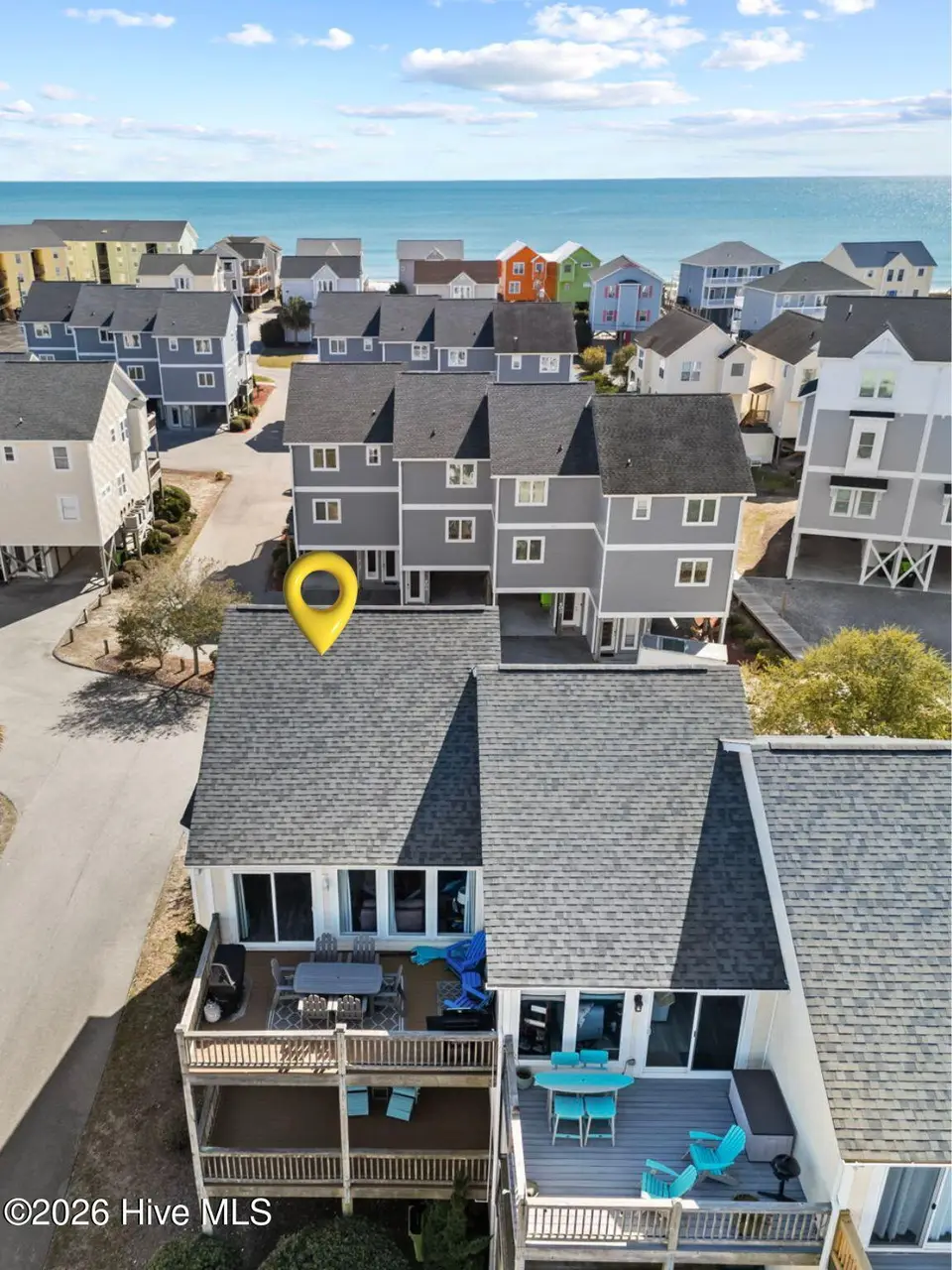 828 /102 N New River Drive 102, Surf City, NC 28445 — 4-bedroom waterfront townhome in Carolina Shores, Surf City, NC, photo 1 of 39: Exterior View 102