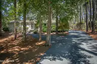 12 Whithorn Court, Pinehurst, NC 28374 — 3-bedroom home in Pinewild CC, Pinehurst, NC, photo 2 of 33: FrontExterior1