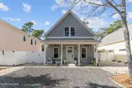 137 NE 75th Street, Oak Island, NC 28465 — 3-bedroom home in Tranquil Harbor, Oak Island, NC, photo 2 of 55: 1-web-or-mls-BTS00933