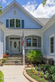 497 Broomsedge Court SE, Bolivia, NC 28422 — 4-bedroom waterfront home in Winding River Plantation, Bolivia, NC, photo 4 of 60: Front of home