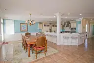 5715 Ocean Drive, Emerald Isle, NC 28594 — 8-bedroom waterfront home in Surf Landing Cove, Emerald Isle, NC, photo 9 of 64: Dining and Kitchen
