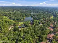 70 Royal Dublin Downs, Pinehurst, NC 28374 — 4-bedroom waterfront home in National, Pinehurst, NC, photo 2 of 53: Drone over home
