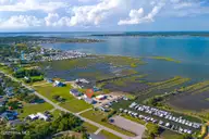 221 Bayview Drive, Harkers Island, NC 28531 — 2-bedroom waterfront home in Earl Davis, Harkers Island, NC, photo 1 of 53: 221 Bayview Drive, Harkers Island