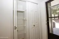 250 Sugar Gum Lane 124, Pinehurst, NC 28374 — 3-bedroom condo in Lakeview Condos, Pinehurst, NC, photo 6 of 55: Pantry/Front Door