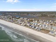 1025 W Beach Drive, Oak Island, NC 28465 — 3-bedroom waterfront home, Oak Island, NC, photo 3 of 45: 9-web-or-mls-DJI_20260122121949_0275_D