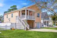 135 NE 75th Street, Oak Island, NC 28465 — 4-bedroom home in Tranquil Harbor, Oak Island, NC, photo 3 of 37: Front