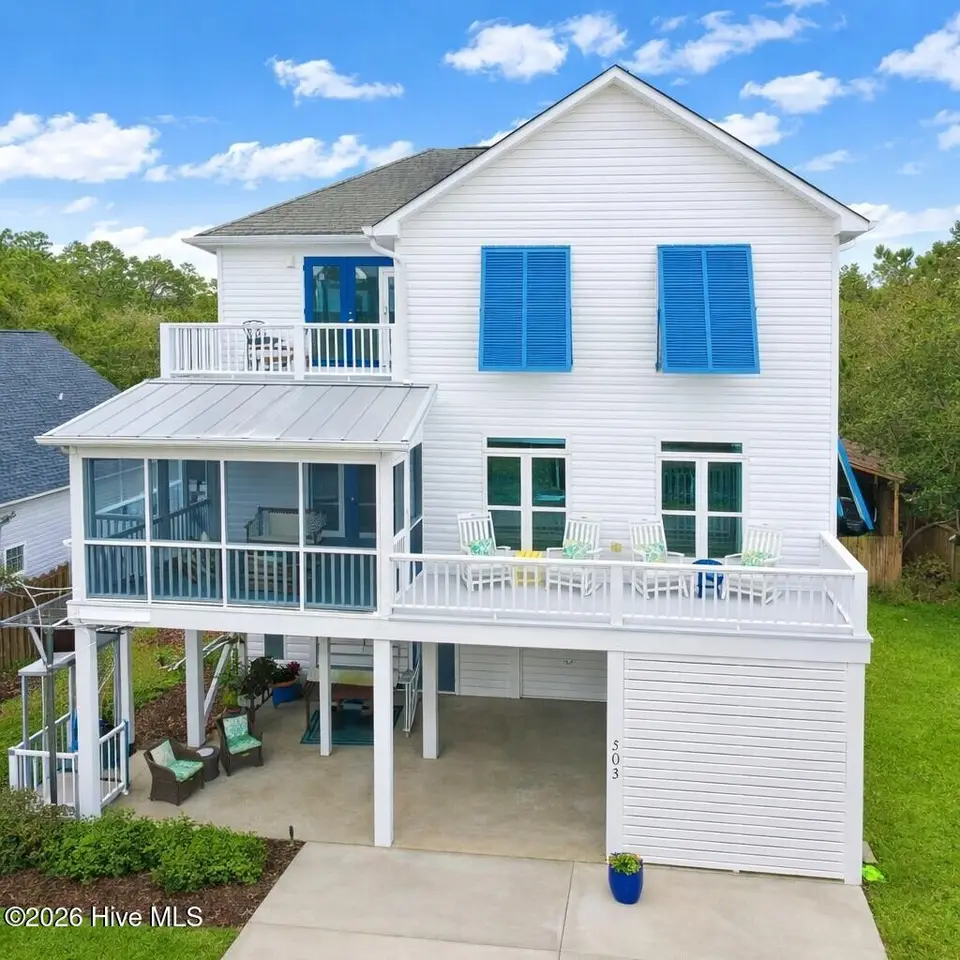 503 W Yacht Drive, Oak Island, NC 28465 — 4-bedroom home in Tranquil Harbor, Oak Island, NC, photo 1 of 53: Primary photo