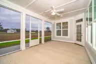 105 Windswept Lane, Beaufort, NC 28516 — 4-bedroom home in Beaufort Club, Beaufort, NC, photo 11 of 45: Spacious Screened Porch