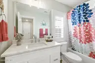 135 NE 75th Street, Oak Island, NC 28465 — 4-bedroom home in Tranquil Harbor, Oak Island, NC, photo 22 of 37: 3rd Bathroom