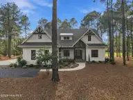 33 Devon Drive, Pinehurst, NC 28374 — 4-bedroom home in Pinewild CC, Pinehurst, NC, photo 1 of 38: 1-web-or-mls-DJI_20261016162947_0992_D-E